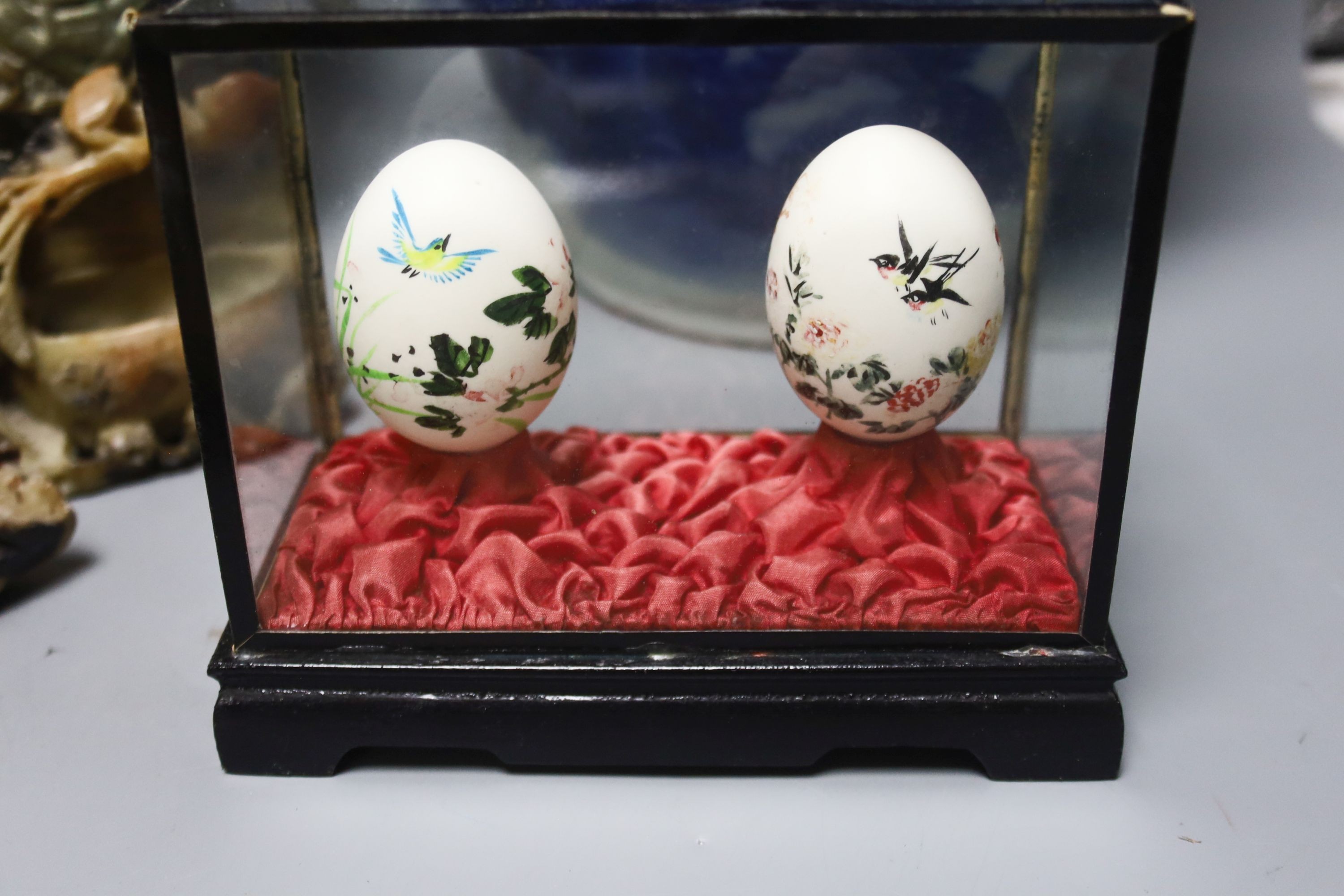 A large Chinese vase, a.f., 47cm, a pair of soapstone carvings, embossed Chinese brass ornament and cased pair of painted eggs